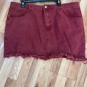 Adorable maroon denim mini with distressed hem.